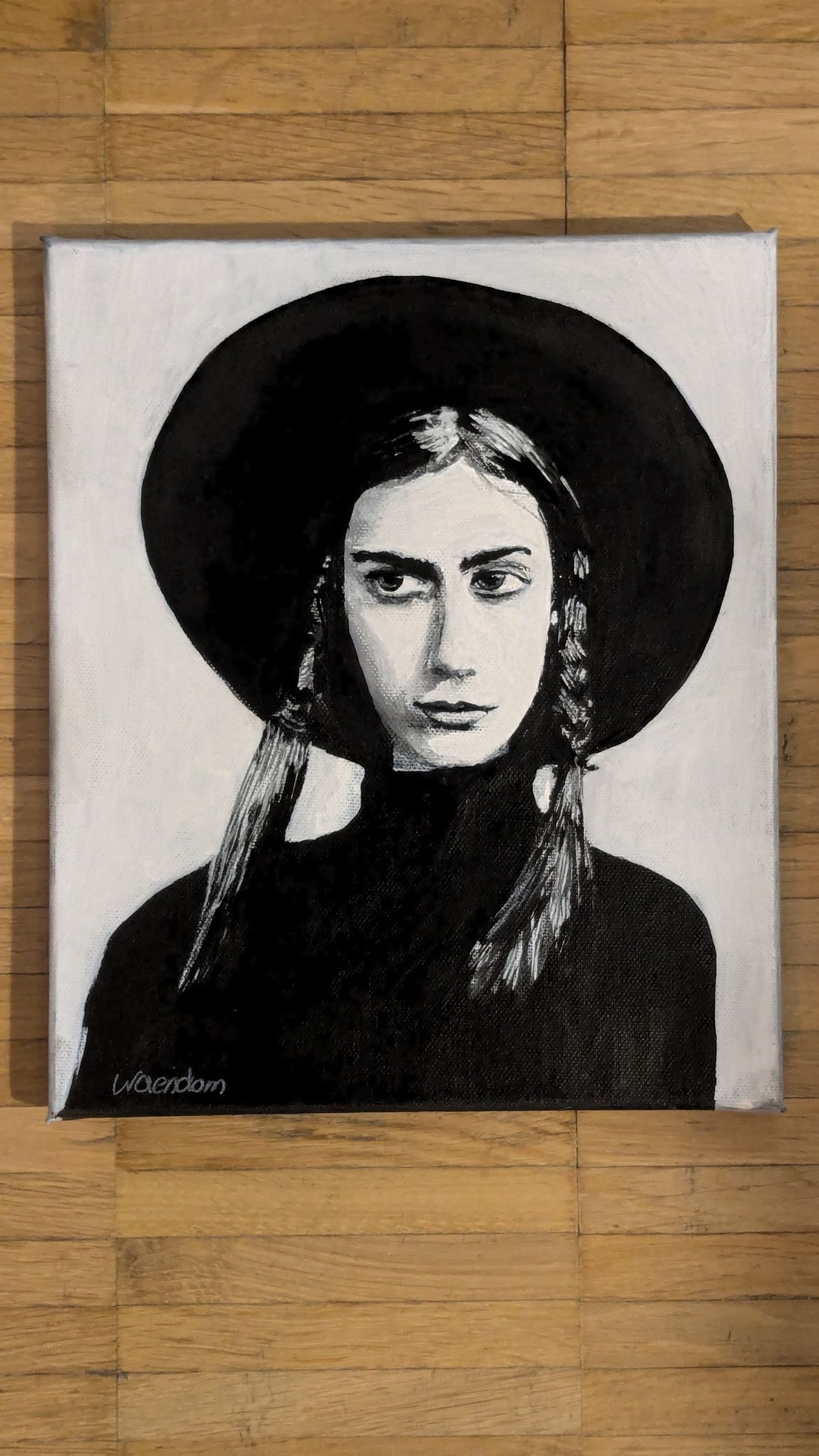 Acrylic on canvas in black and white: a woman in a wide-brimmed hat with two braids, looking to one side